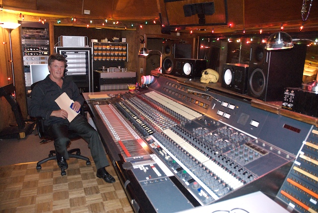 Bruce Stratton sitting at console in recording studio